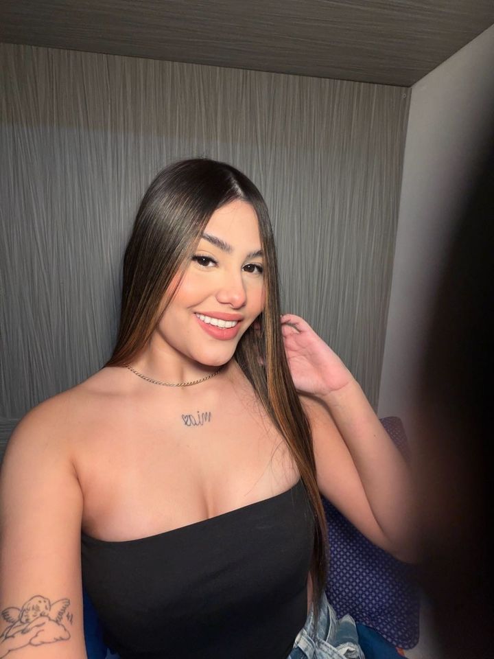 Woman with long hair in a relaxed evening video chat